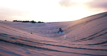 Image showing Hill, sand or athlete on motorcycle for adventure, action or fitness with wellness in outdoor workout. Sunset, desert or sports driver on motorbike on dunes in training, exercise or race challenge