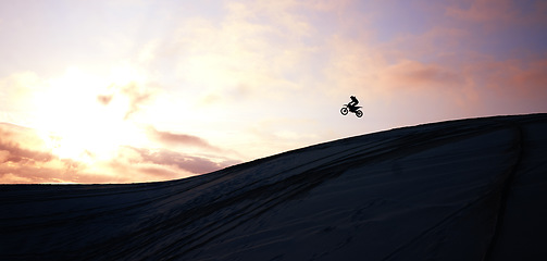 Image showing Jump, person and motorcycle for training or sports with fitness, balance or challenge in nature on mock up space and sky. Bike, freedom and adventure for competition, exercise or talent in desert