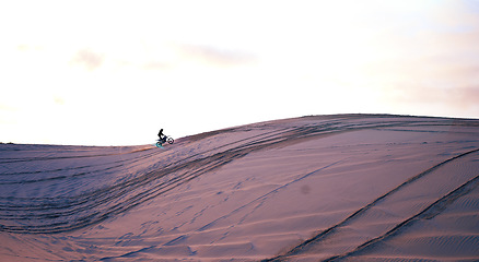 Image showing Hill, desert mockup or athlete on motorcycle for action, adventure or fitness with wellness or space. Sunset, sand or sports driver on motorbike on dunes in training, exercise or race challenge