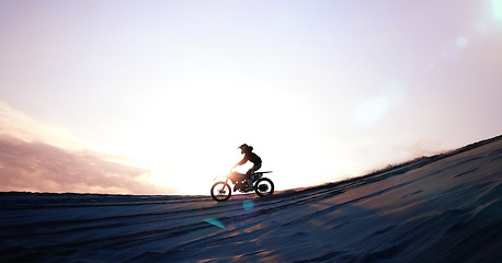 Image showing Motorcycle, person and driving for training or sports with fitness, balance or challenge in nature on mock up space and sky. Bike, freedom and adventure for competition, exercise or talent in desert