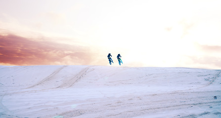 Image showing Sand, desert or people driving motorcycle for action, adventure or fitness with performance or adrenaline. Teamwork, sports or athletes on motorbike on dunes for training, exercise or race challenge