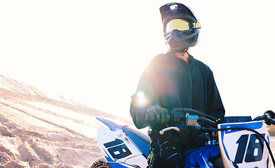 Image showing Ready, sand or sports athlete on motorcycle for action, adventure or fitness with wellness, or adrenaline. Thinking, view or free driver on motorbike on dunes in training, exercise or race challenge