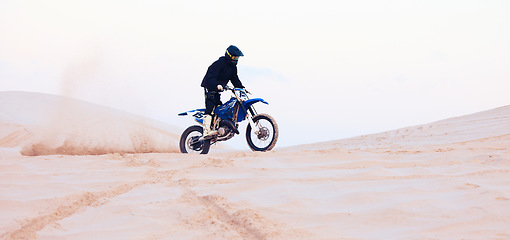 Image showing Sand, dust or athlete driving motorcycle for action, adventure or fitness with performance or adrenaline. Desert, sports or person on motorbike on dunes for training, exercise or race or challenge