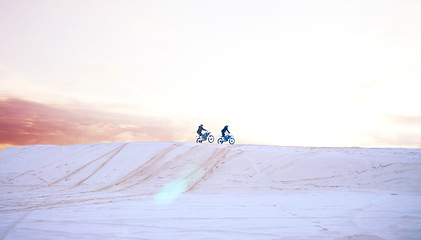 Image showing Sand, nature or people driving motorcycle for action, adventure or fitness with performance or adrenaline. Teamwork, desert or athletes on motorbike on dunes for training, exercise or race challenge