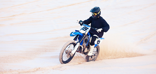 Image showing Desert, speed or athlete driving motorcycle for action, adventure or fitness with performance or adrenaline. Sand, fast or sports person on motorbike on dunes for training, exercise or race challenge