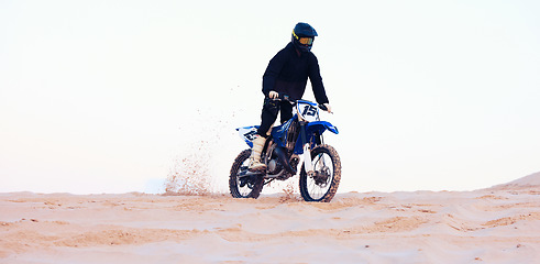 Image showing Desert, dust or athlete driving motorcycle for action, adventure or fitness with performance or adrenaline. Sand sports or person on motorbike on dunes for training, exercise or race or challenge