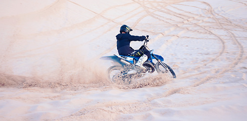 Image showing Dirt, sand or athlete driving motorbike for action, adventure or fitness with performance or adrenaline. Nature, dust or sports driver on motorcycle on dunes in training, exercise or race challenge