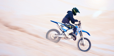 Image showing Dirt, motorbike and athlete in sports, adventure and man driving on desert, sand dune and outdoor riding in nature. Extreme sport, bike or motorcycle drive with helmet, gear or person with freedom