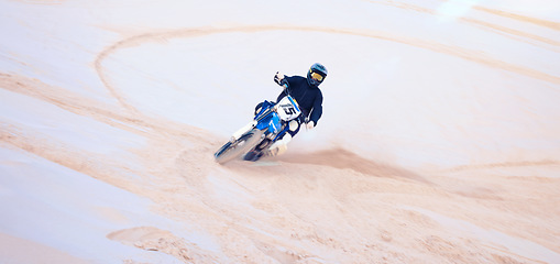 Image showing Race, desert and a person on a bike for travel, extreme sport and adrenaline on a vacation. Sand, competition and a bike or racer for cycling, training or adventure for performance on a motorbike