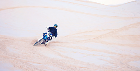 Image showing Motorcycle, desert and man training for sports, adventure or travel journey outdoor. Motorbike, rider and driver on sand, dirt and off road for freedom, extreme race and competition on mockup space