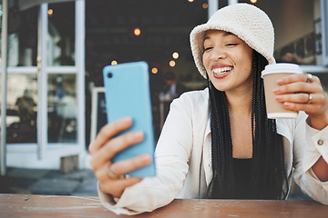 Image showing Phone, selfie and woman with a coffee in the city at a cafe on a weekend adventure with happiness. Smile, fun and young female person drinking latte and taking a picture on cellphone outdoor in town.