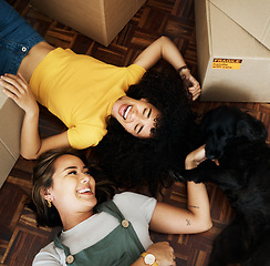 Image showing New home, dog and happy couple of friends moving, relax and bond on house, real estate or property floor. Animal pet, boxes and laughing lesbian women, gay partner or homeowner people in relocation