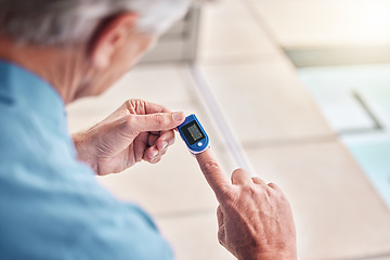 Image showing Closeup, digital oximeter and elderly hands measure oxygen saturation, pulse or heart health. Finger, blood test monitor and senior man in retirement home for healthcare, medical check and wellness