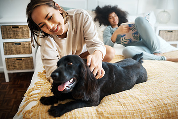 Image showing Pet, bed and happy lesbian couple play in home, morning and relax together in house. Dog, bedroom and gay women with animal, bonding and having fun in healthy relationship, lgbtq connection and care