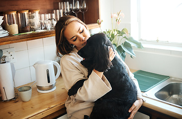 Image showing Hug, love and woman with a dog in home kitchen to relax and play with animal. Pet owner, happiness and asian person playing with companion, care and wellness or friendship in cozy apartment