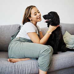 Image showing Happy, love and woman with dog in home sofa to relax and play with animal. Pet owner, care and asian person on couch with companion, smile and wellness or friendship and together in cozy apartment