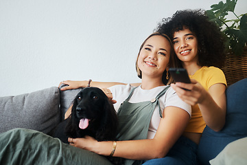 Image showing Dog, relax or gay couple watching tv in home together in a lgbtq love connection on living room sofa. Remote, sofa or happy lesbian women smile with pet, bond or care on couch for movie on television