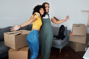 Image showing Lesbian, couple and hug for moving, home and dog in living room with excited, happiness and celebration in apartment or property. Happy, people and women together with boxes and pet in new house