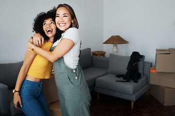 Image showing Lesbian, couple and hug for moving, home and dog in living room with excited, happiness and investment in apartment or property. Happy, people and women together with pet in celebration of new house
