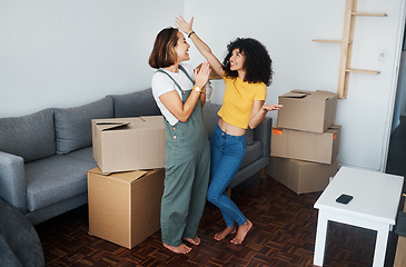 Image showing Homeowner, lesbian and celebration with couple, boxes and excited with happiness, achievement and property. Queer people, happy girls and women with cardboard, real estate and relationship with goals