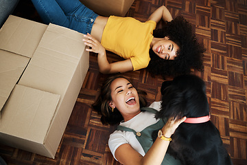 Image showing Moving, boxes and couple with a dog in home, living room or women relax together on floor bonding with puppy or pet. New house, happiness or people with love for animal and investment in property