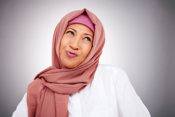 Image showing Fashion, smile and Muslim woman thinking in studio isolated on a gray background. Happy Islamic female model in makeup, cosmetics and confident in trendy clothes, traditional hijab and stylish scarf