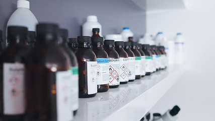 Image showing Research, pharmaceutical chemical and bottle on shelf in laboratory with medical warning label, science and cure. Healthcare, medicine and innovation in manufacturing of poison antidote and vaccine