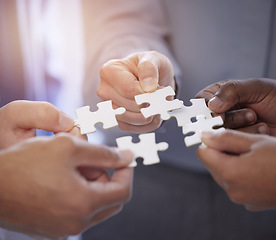 Image showing Business people, hands and teamwork with puzzle collaboration for problem solving, growth and development. Meeting, diversity and coworking jigsaw in team building huddle, men and women with solution