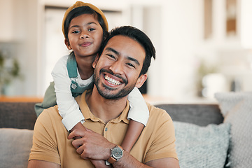 Image showing Portrait, home and father with girl, hug and bonding with happiness, weekend break and love in a lounge. Face, family and single parent with child, dad and kid on a couch, relax and rest with care