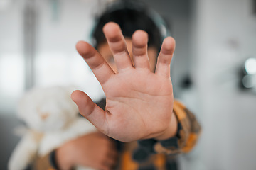 Image showing Child, stop and hand closeup for protest, rejection and sign for prohibition of domestic violence. Palm, warning and kid against discrimination, racism and bullying at school, abuse and harassment