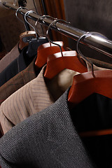 Image showing Coats on Clothes hanger