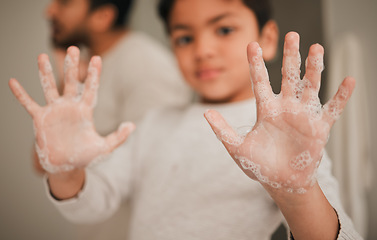Image showing Child, hands and soap, cleaning and hygiene, grooming and safety from bacteria with closeup at home. Health, wellness and protection, foam and palm with young person learn handwashing and skincare