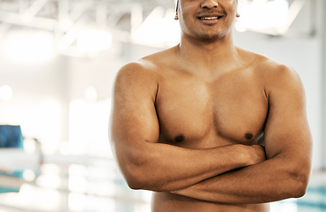 Image showing Man, shirtless and swimmer the arms crossed at pool, fitness and professional athlete with fitness. Exercise, aquatic sports and confidence with mockup space, bare chest and swimming with training