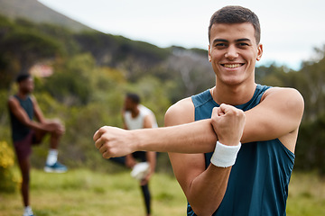 Image showing Fitness, stretching and portrait of a man outdoor for health and wellness. Happy runner, athlete or sports person in nature park to start exercise, workout or training with arm muscle warm up