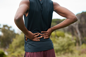 Image showing Fitness, nature and a person with back pain after hiking with a sports injury or accident. Tired, healthcare and an athlete or runner with muscle strain, inflammation or emergency after training