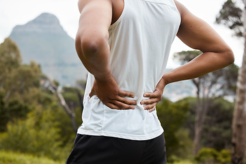 Image showing Fitness, nature and a person with back pain after running with a sports injury or accident. Tired, healthcare and an athlete or runner with muscle strain, inflammation or emergency after training