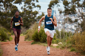 Image showing Marathon, race and people running in nature for fitness competition or sports challenge. Runner or athlete men together for exercise, workout or cardio performance with speed, commitment and wellness