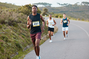 Image showing People, fitness and running on road in marathon, sports or outdoor race together in nature. Group of athletic runners on street in cardio workout, training or exercise for competition or triathlon