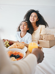 Image showing Hands, mothers day and breakfast in bed, home and happy woman with girl, gift box and kindness for love. Mom, child and person with food, brunch and present in bedroom for bonding in family house