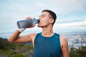 Image showing Man, fitness and drinking water in nature, workout or outdoor exercise on break, rest or recovery. Thirsty male person, sports drink or mineral for sustainability after running, cardio or training