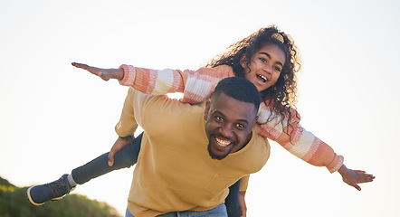 Image showing Dad, girl child and piggy back for airplane on holiday, garden or outdoor in summer, bonding or playful. Father, kid and happy for game, love or care in backyard, park or nature for plane in sunshine