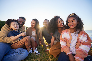 Image showing Parents, grandparents and children on grass outdoor laughing together on funny vacation in summer. Interracial family on beach for holiday picnic with smile of men, women and kids for generation love