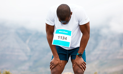 Image showing Marathon, break or tired runner on road for exercise, fitness training or outdoor workout. Sports race, black man or exhausted athlete with endurance or fatigue in challenge to relax by mountains