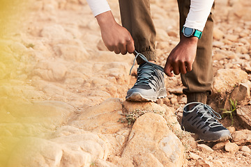 Image showing Tie, mountain or hands of hiker with shoes for fitness training, exercise or outdoor workout. Lace, walking closeup or legs of person with footwear ready to start hiking on rock or ground in nature
