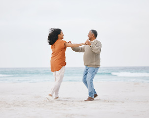 Image showing Beach, dance and senior happy couple love, fun date or care on travel holiday, retirement or nature vacation energy. Free dancer, ocean sea and elderly man, old woman and marriage people bond on sand