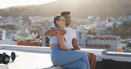Image showing Fitness, couple and city to rest for exercise, workout or training together on a building rooftop. Happy man and woman on sports outdoor break with smile, communication or conversation in Cape Town