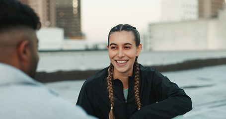 Image showing Fitness, happy and woman athlete in the city for a health, wellness and cardio workout or exercise. Smile, sports and young couple on a rest or break after training on rooftop in urban town.