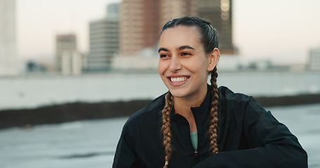 Image showing Fitness, smile and woman athlete in the city for a health, wellness and cardio workout or exercise. Happy, sports and young female person on a rest or break after training on rooftop in urban town.