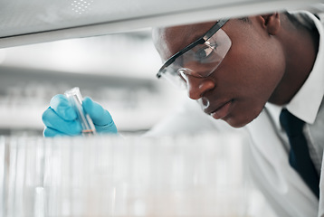 Image showing Man, test tube and science research in laboratory for medical investigation, innovation and vaccine development. African scientist, chemistry and planning analysis for medicine, dna results or sample