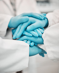 Image showing Ppe, Nurses and hands together for support, teamwork and solidarity in hospital with gloves. Doctors, working people and professional in collaboration for healthcare, motivation and community